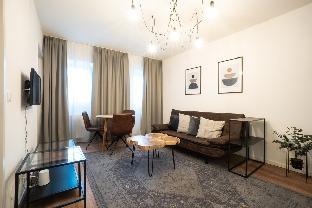 Elegant apartment with wood tables. - image 4